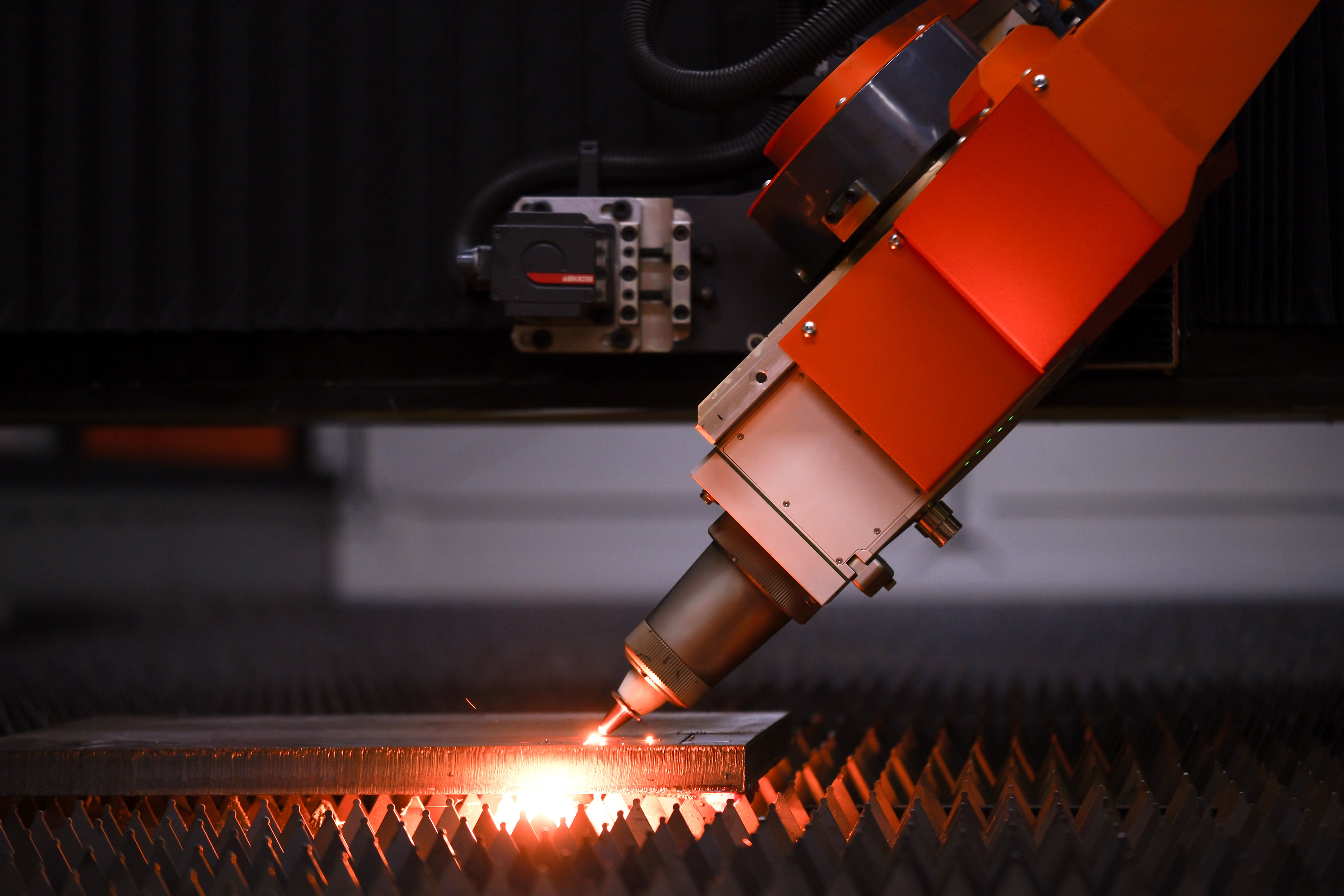 Bevel cutting on the shop floor, sparks at the cut point